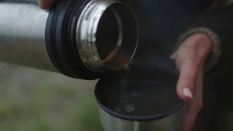 Pour tea from a thermos closeup Stock Footage 70772823