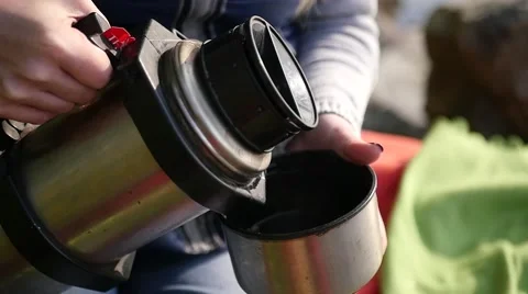 Pour tea from a thermos Stock Footage 68867507