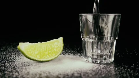 Pour tequila in a shot. Slow motion Stock Footage 76433609