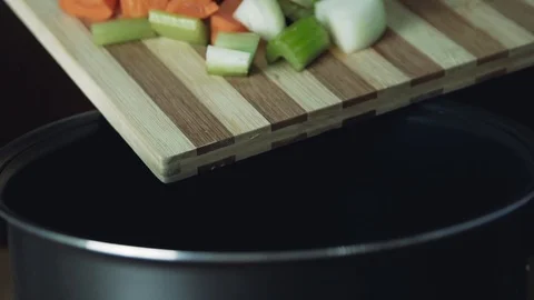 Pour the vegetables into the pan. Cooking vegetable soup. Healthy food, close Stock-Footage 110704959
