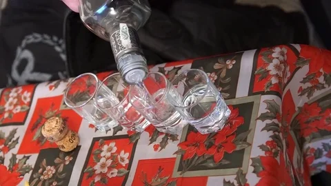 Pour vodka into glasses. Video stock 74761474
