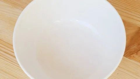 Pour walnuts into a Cup. Close-up Stock-Footage 111145719