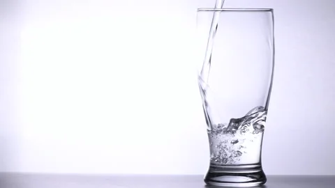Pour water into empty glass isolated on white background, Stock-Footage 161107688