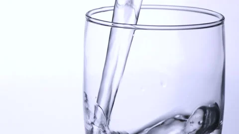 Pour water into empty glass isolated on white background, Stock-Footage 161108322