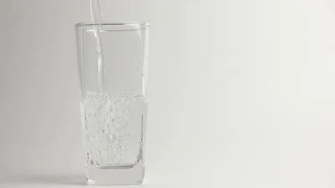 Pour water into a glass. Stock Footage 198297595