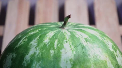 Pour water on the watermelon Stock Footage 136475189