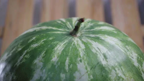 Pour water on the watermelon Stock Footage 136476155