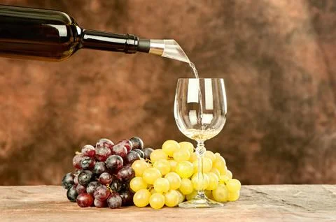 Pour wine in cup Stock Photos