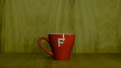 Poured coffee in a stylish red cup Video stock 129768344