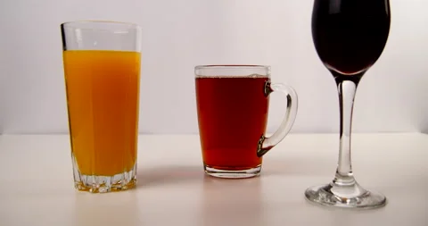 Poured drinks in glasses tea and juice Stock Footage 143121209