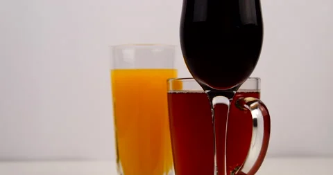 Poured drinks in glasses tea and juice Stock Footage 143121528