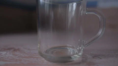 Poured into a transparent cup and hot water is brewed tea Stock Footage 59774695