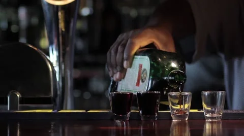 Pouring alcohol at bar Stock Footage