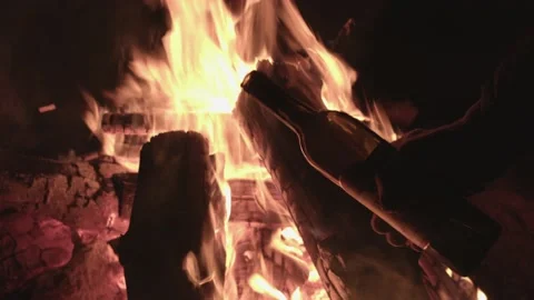 Pouring alcohol into the fire Stock Footage