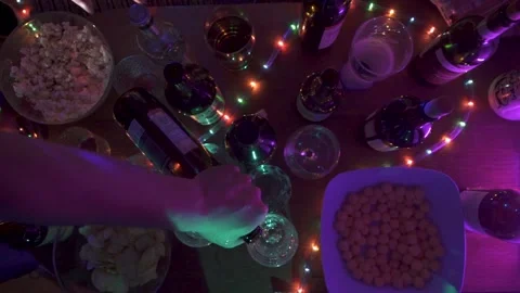 Pouring alcohol on a party 스톡 동영상 155844653