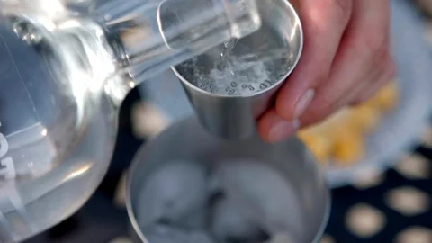 Pouring Alcohol into Shaker Stock Footage 97188689