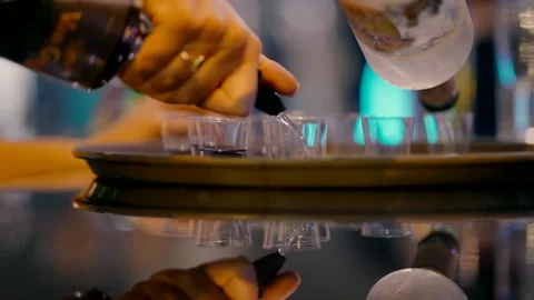 Pouring alcohol in shots on the tray Stock-Footage 220126580