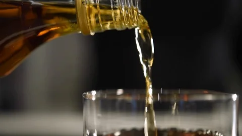 Pouring alcohol in slow motion 60fps Stock Footage
