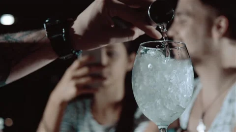 Pouring the alcohol in slow motion Stock Footage 67862780
