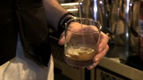 Pouring and serving an alcoholic drink Stock Footage 8574272