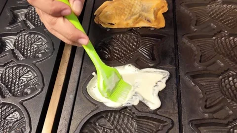 Pouring and spreading waffle batter, Thailand Stock Footage 344373395
