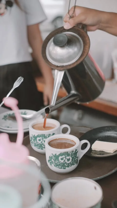 Pouring and Stirring Two Cups of Coffee Stock Footage 278219129