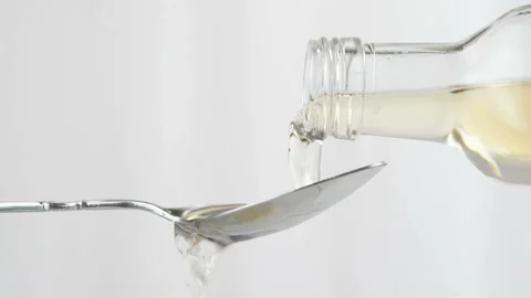 Pouring apple cider vinegar Stock Footage 168468567