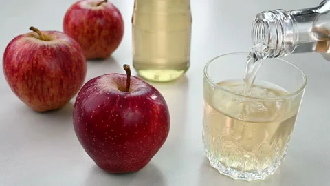 Pouring apple cider vinegar Stock Footage 228717126