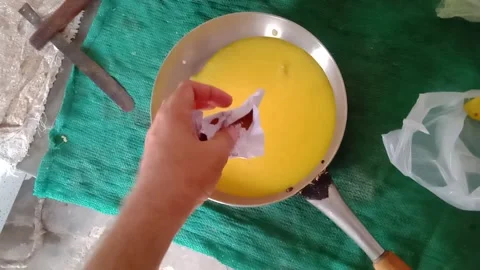 Pouring Aromatic Spices and Masala into Cooked Lentils for Traditional Fry Stock Footage 341451460