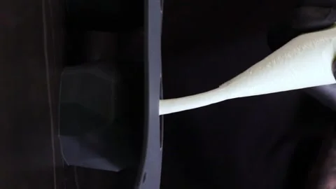 Pouring Batter into Baking Pan - Vertical Video Stock Footage 247138669