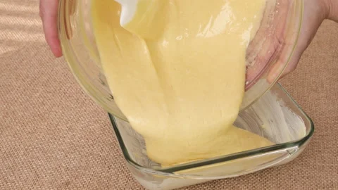 Pouring batter into a dish. Apple cake recipe Stock Footage 169429405