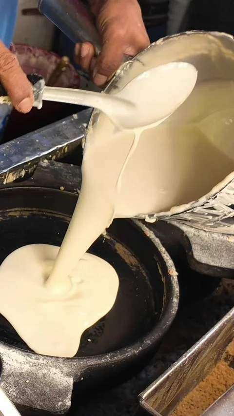 Pouring Batter on Hot Griddle to Make Thin Crepe Pancake, Phuket Night Market Video stock 326464369