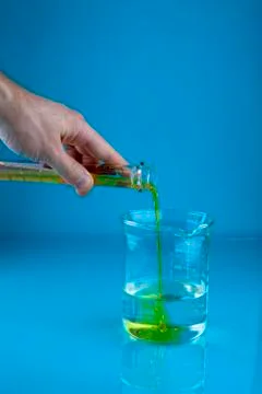 Pouring into a beaker Stock Photos