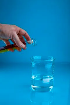 Pouring into a beaker Stock Photos