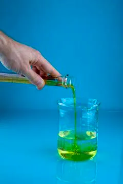 Pouring into a beaker Stock Photos