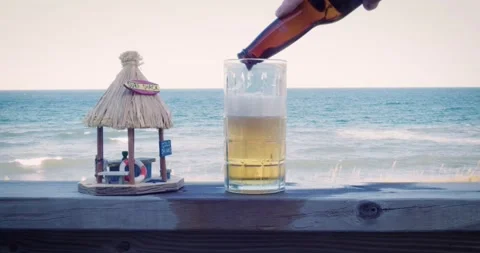 Pouring a Beer at the Beach Video stock 163316989
