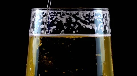 Pouring Beer on Black Background Stock Footage 68033793