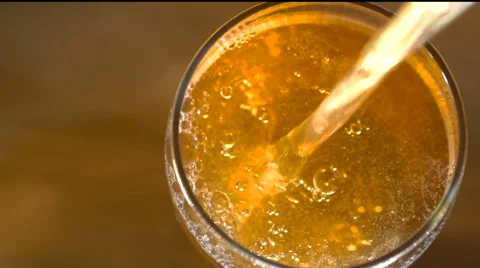 Pouring beer from bottle Stock Footage 62478399