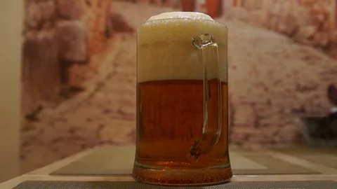 Pouring beer. Cold light beer. Craft beer. A pint of light beer Stock Footage 96196088