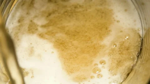  	Pouring beer in a glass close up Stock Footage 210230893