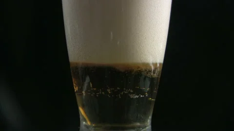 Pouring beer into glass Stock Footage 881985