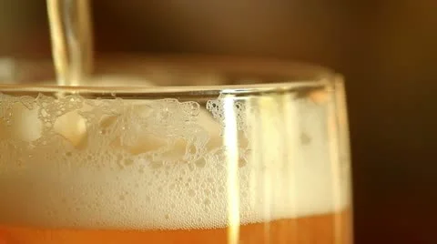 Pouring beer into a glass Stock Footage