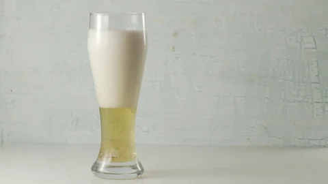 Pouring a beer into glass. Stock Footage 70406372