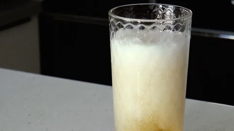 Pouring beer into a glass Stock Footage 78303423