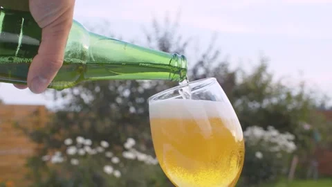 Pouring beer into a glass Stock Footage 138277609