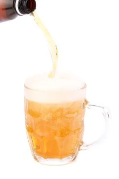 Pouring beer into mug Stock Photos