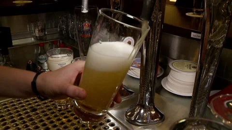Pouring Beer Non-Descript Beer in Bar Video stock 43659636