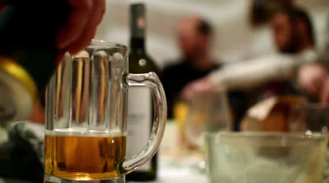 Pouring beer at party Stock Footage 24750865