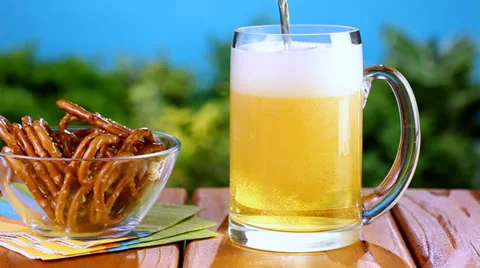 Pouring beer at picnic Stock Footage 24674482