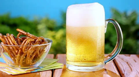 Pouring beer into pint glass Stock Footage 24674366